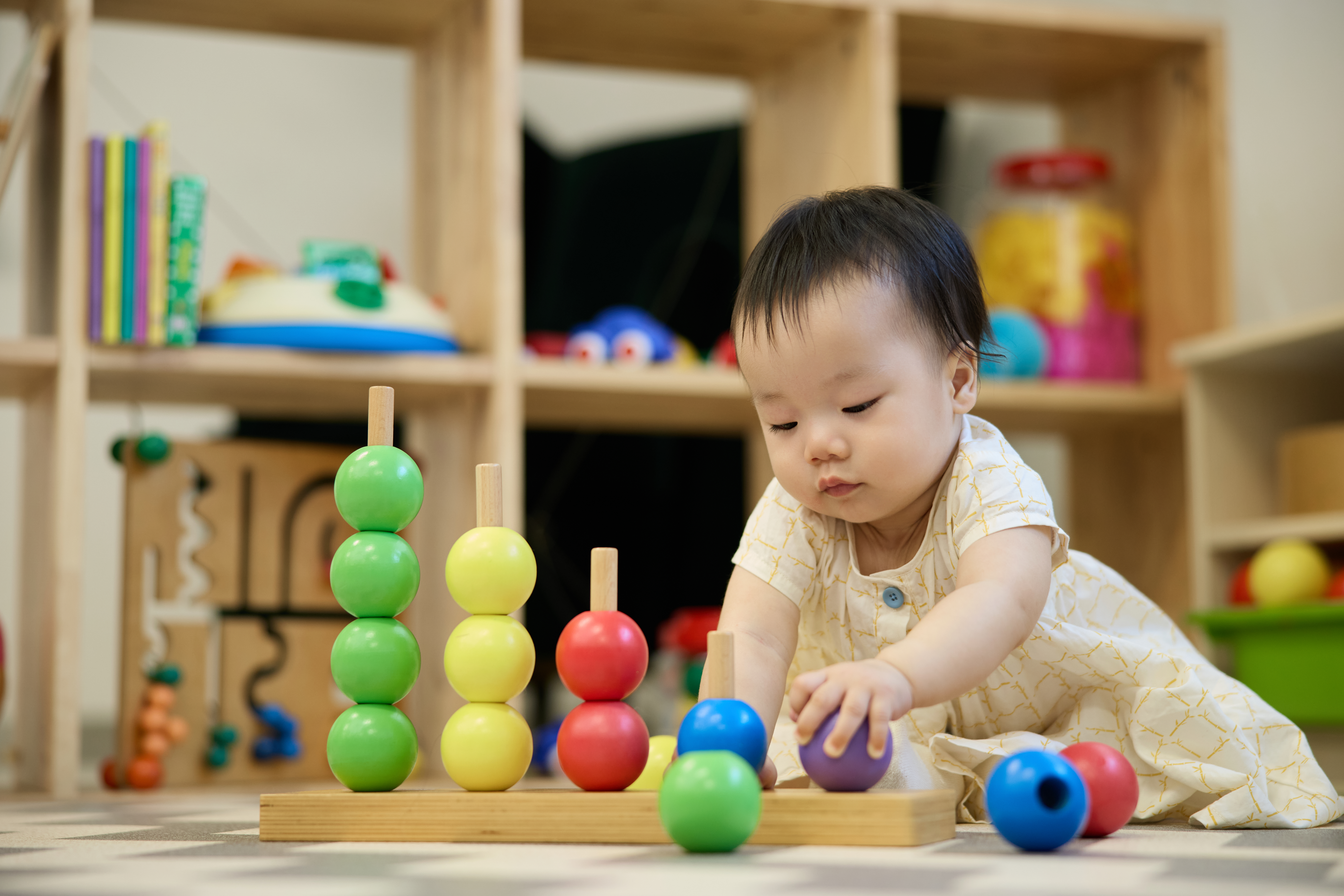Young children playing and learning together at EIBP