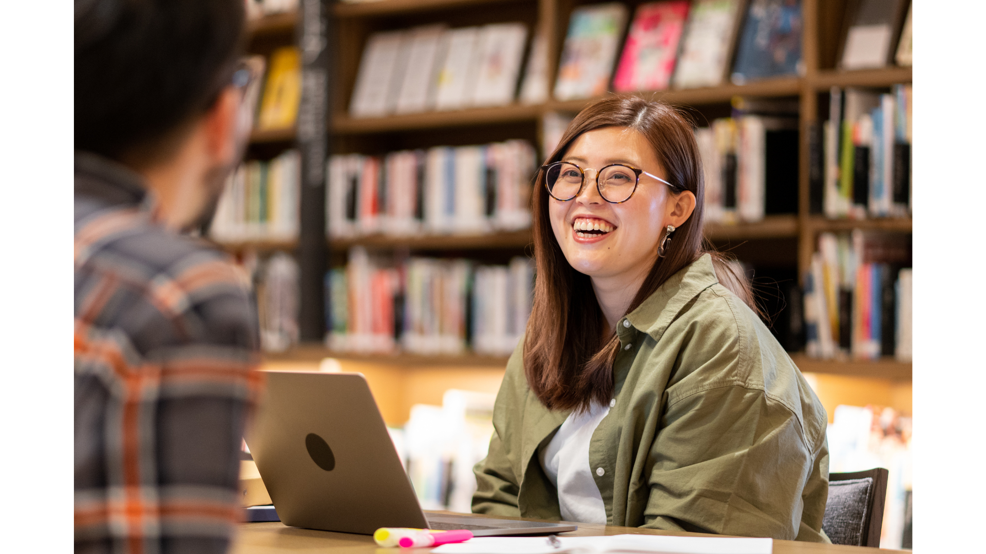 Person looking at colleague at a desk